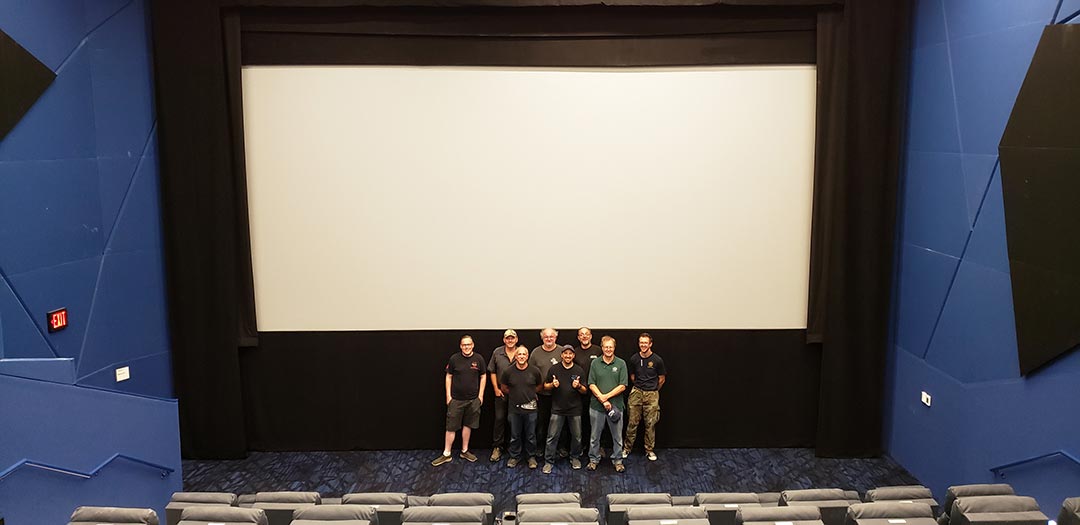 Projection booth with modern and vintage film equipment side by side