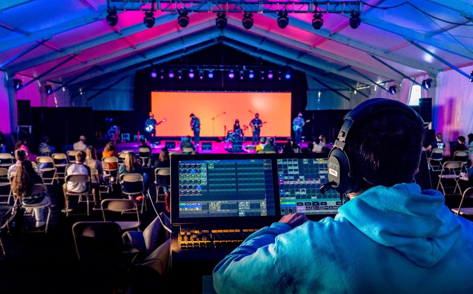 Stadium arranged for banquet and ceremony with white draped areas