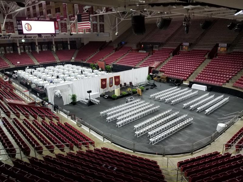 Light technician managing concert visuals from control station