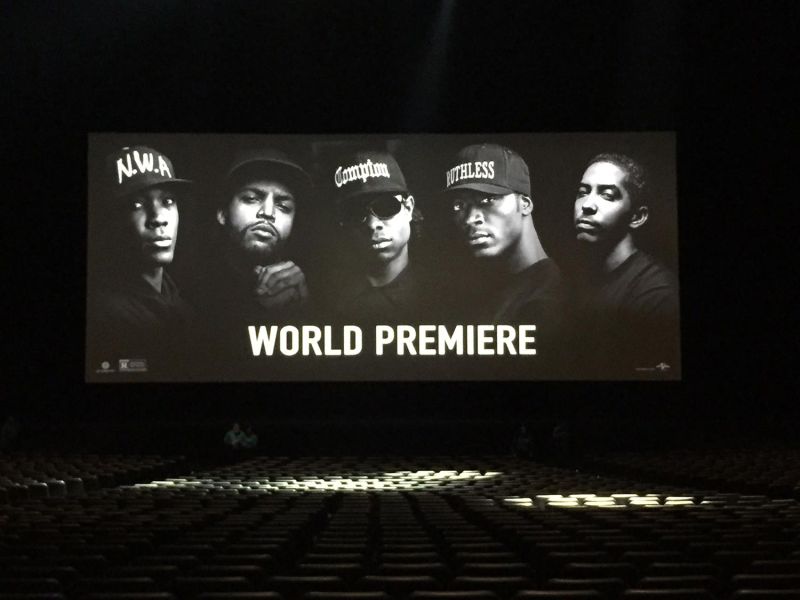 Movie premiere screen displaying N.W.A. members in black and white