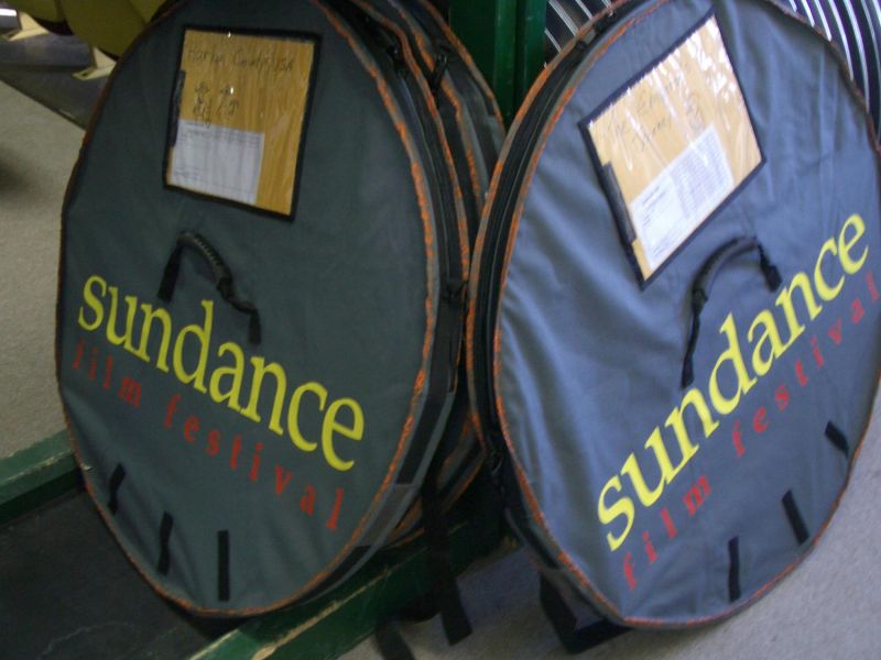 Circular Sundance Film Festival film reel cases with labels and handles