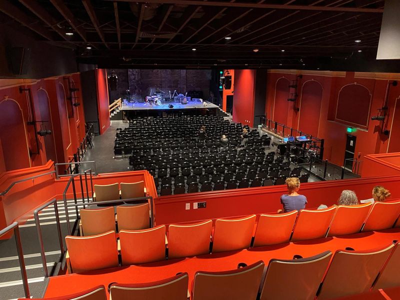 Exterior of United Theatre with marquee and vertical sign
