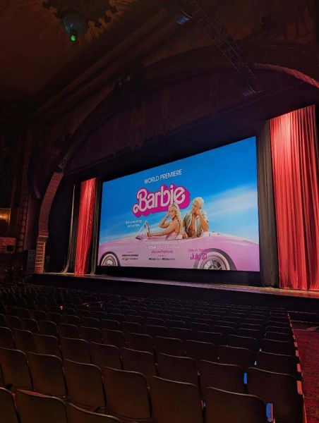 Theater setup with Barbie world premiere on screen